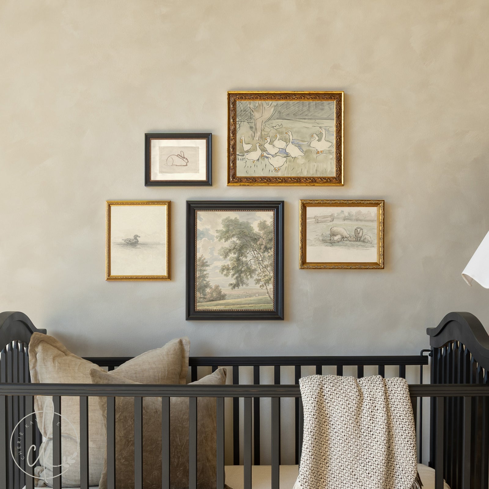 Nursery with black crib and framed artwork on the wall