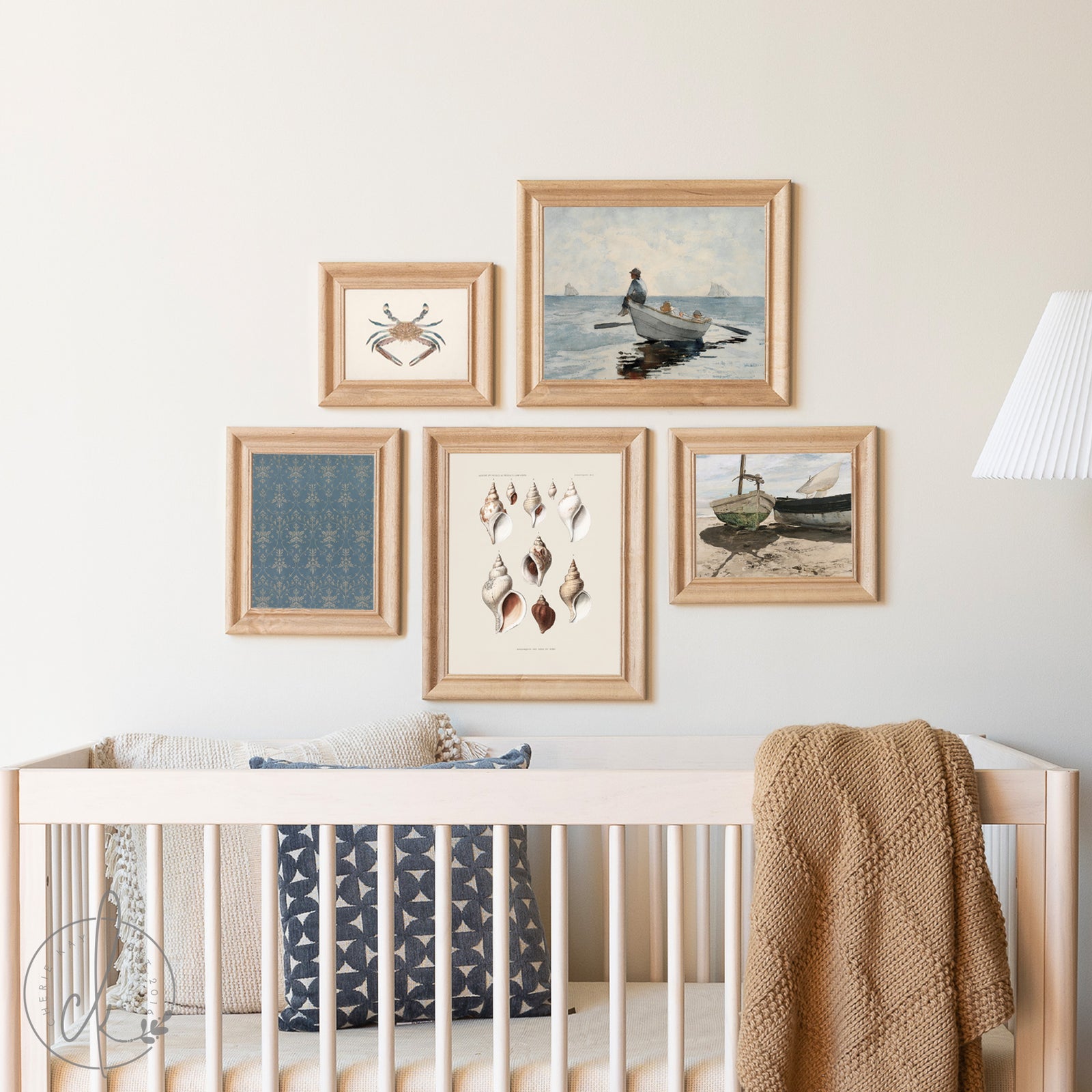 Nursery room with framed artwork on the wall above a crib.