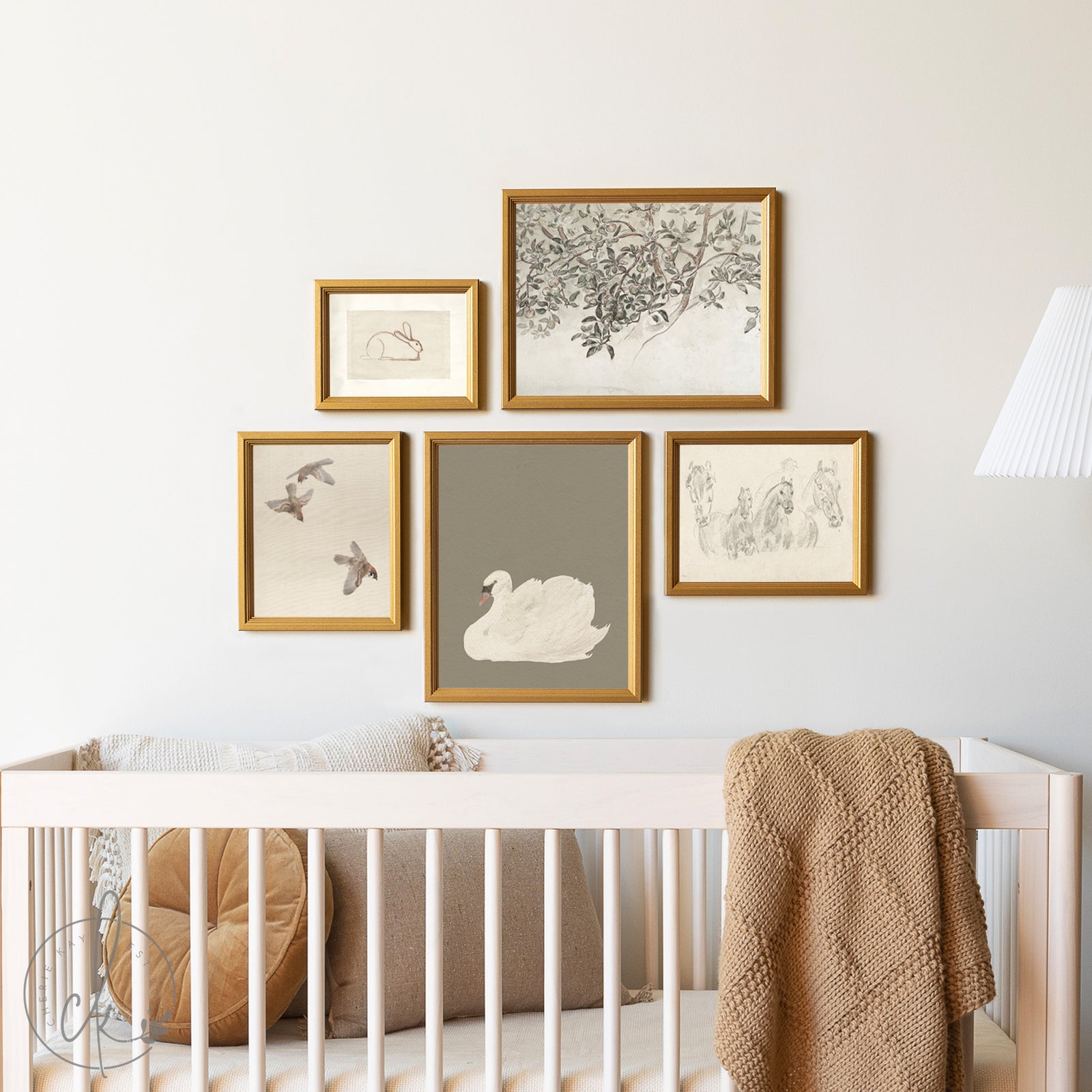 Nursery room with framed artwork on the wall above a crib.