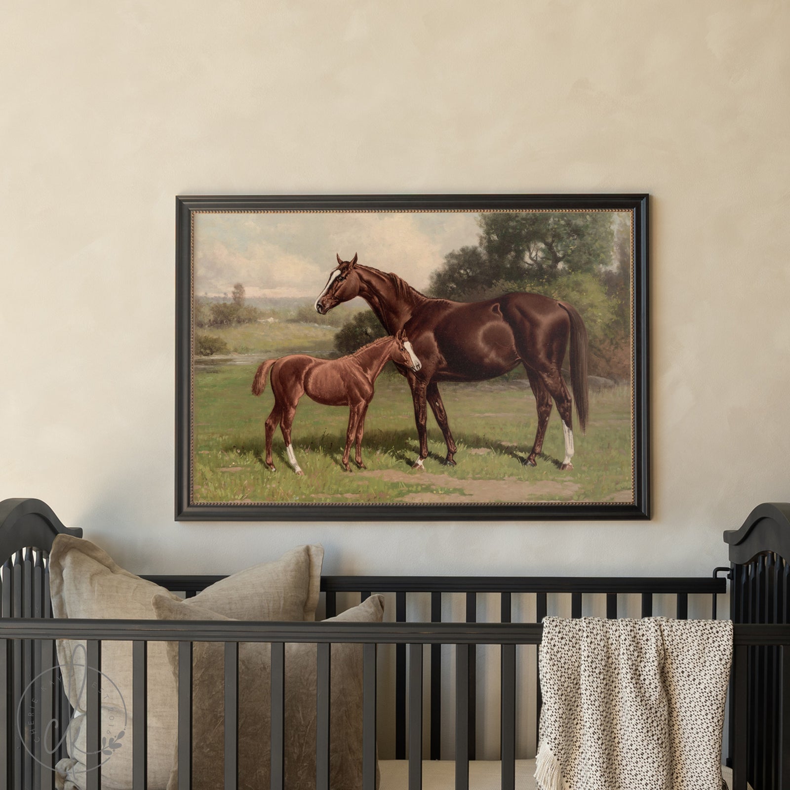 Framed painting of two horses on a wall above a crib