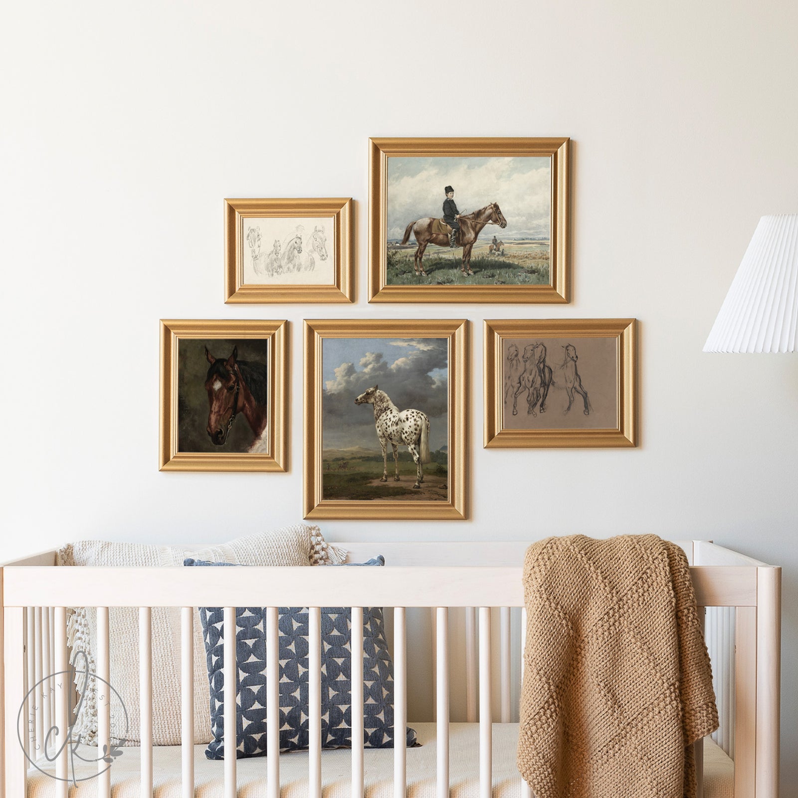Nursery with black crib and wall art featuring horses and riders.