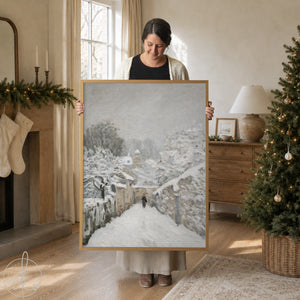 Winter wall art featuring Alfred Sisley’s Snow at Louveciennes framed canvas painting with snowy village scene