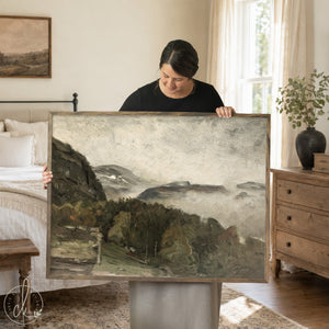 Framed mountain wall art featuring a moody landscape with wood frame and neutral tones for living room or bedroom decor.