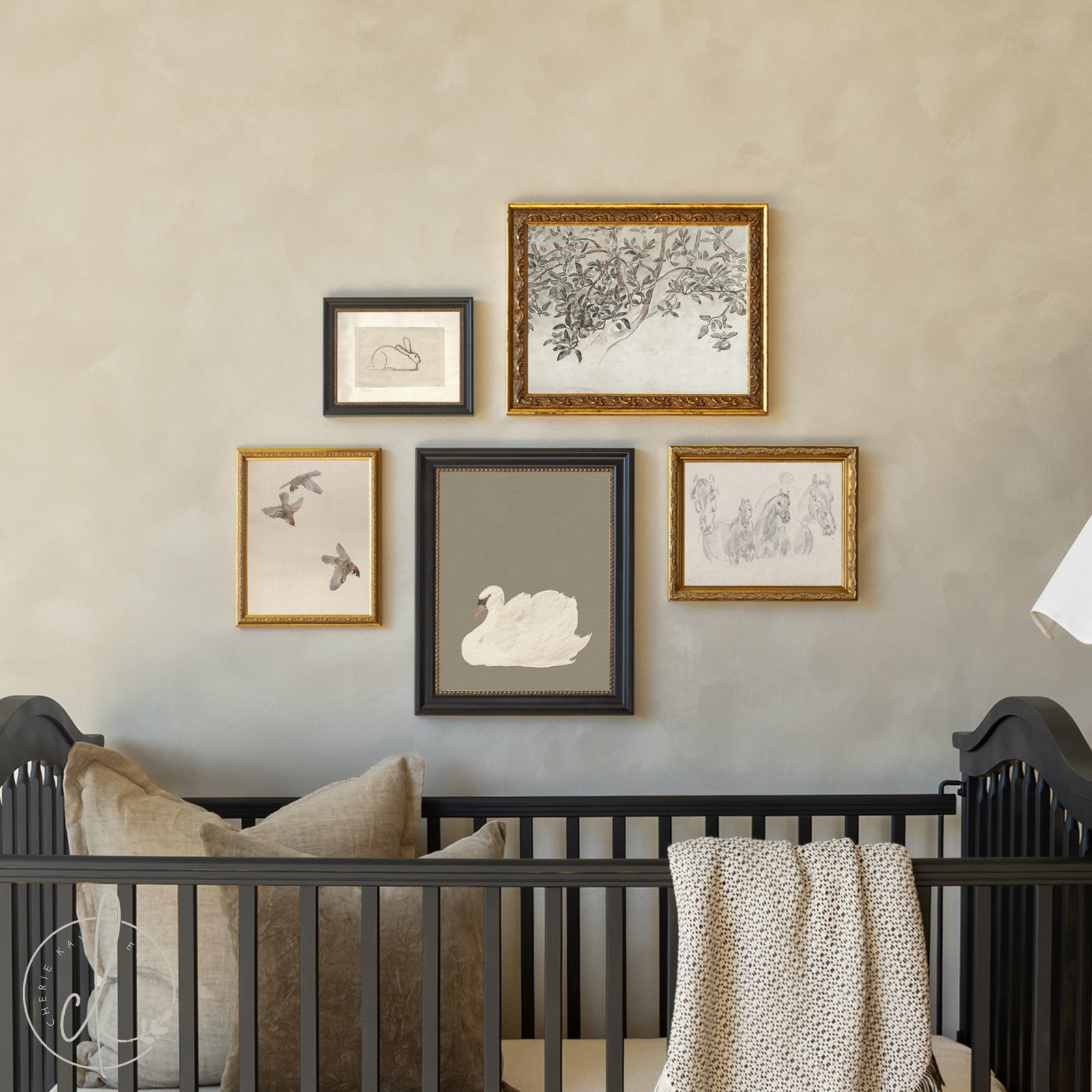 Nursery room with black crib and framed artwork on the wall.