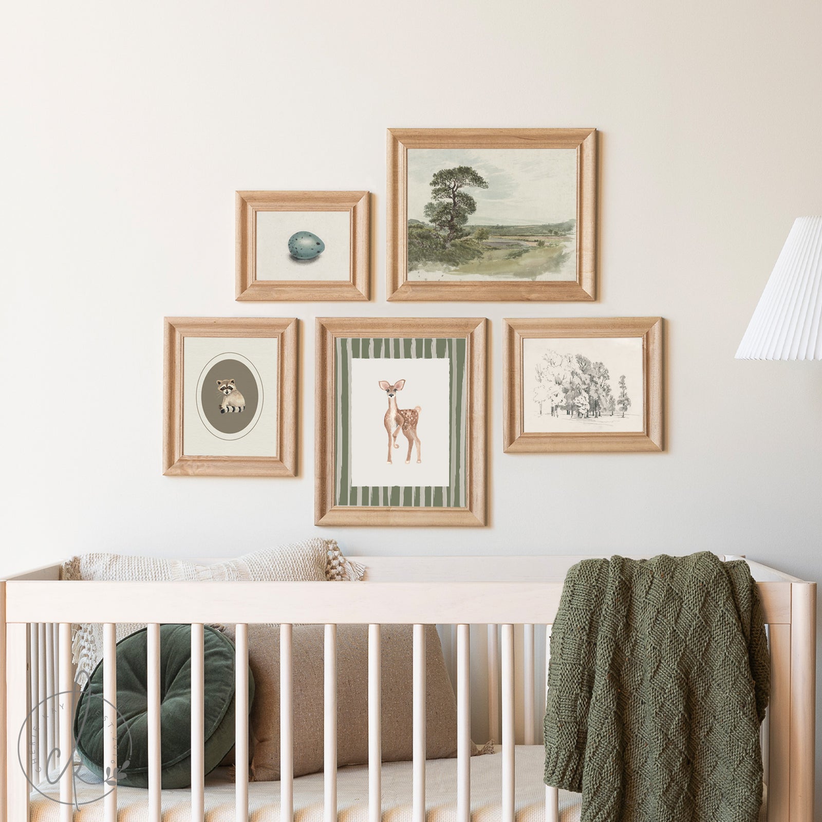 Nursery room with framed artwork on the wall above a crib.