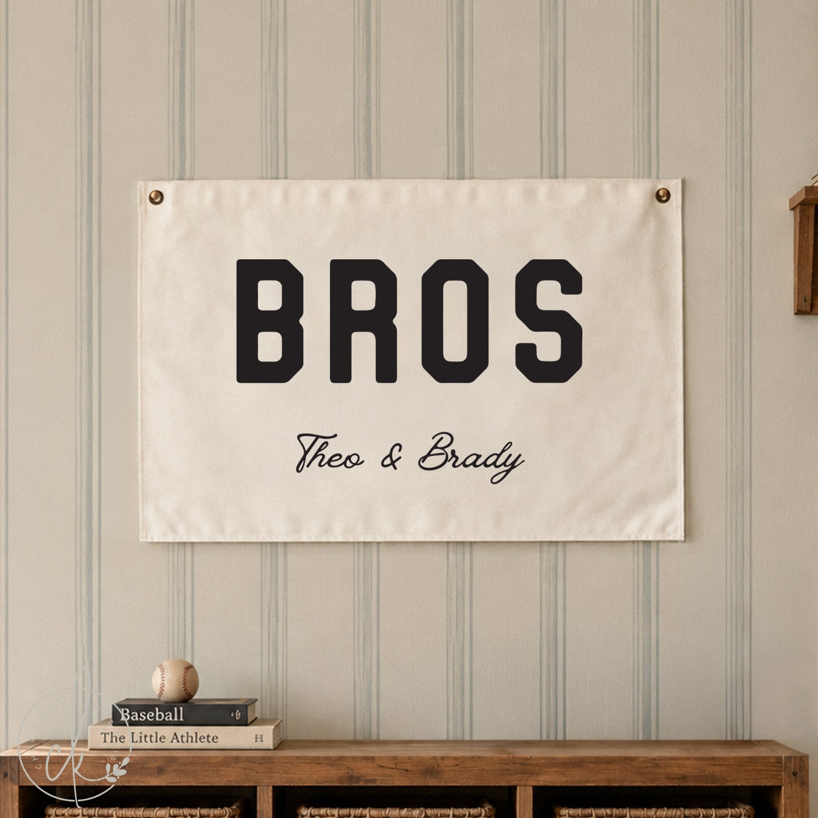 Personalized Bros wall art sign with custom names displayed above a wooden cubby with baskets. 