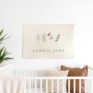 Wildflower nursery decor canvas banner with personalized name and watercolor botanicals on cream canvas