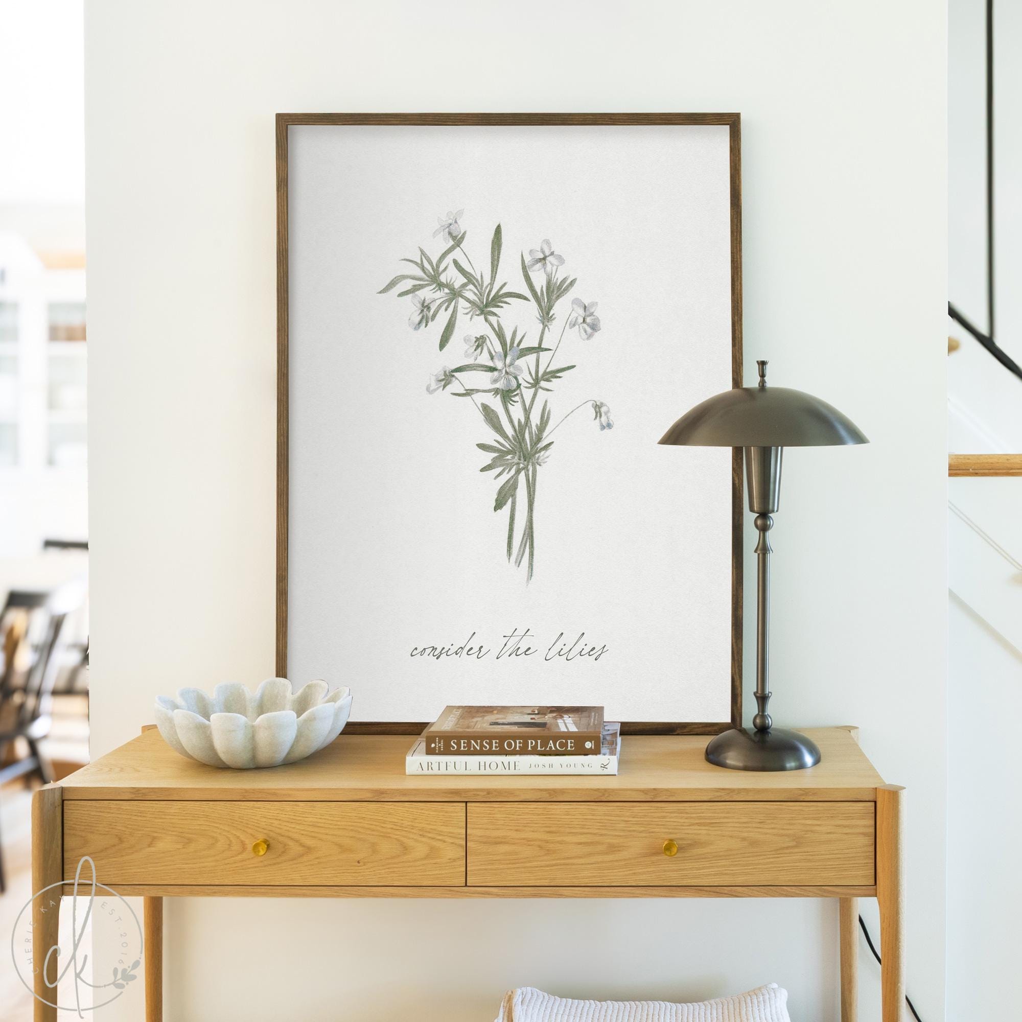 Consider the lilies wall art with scripture and floral design, botanical Christian wall decor perfect for entryway or living room