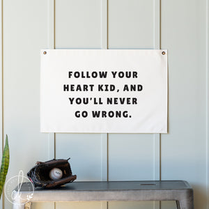 Motivational banner with text on a wall above a shelf with a baseball and glove.
