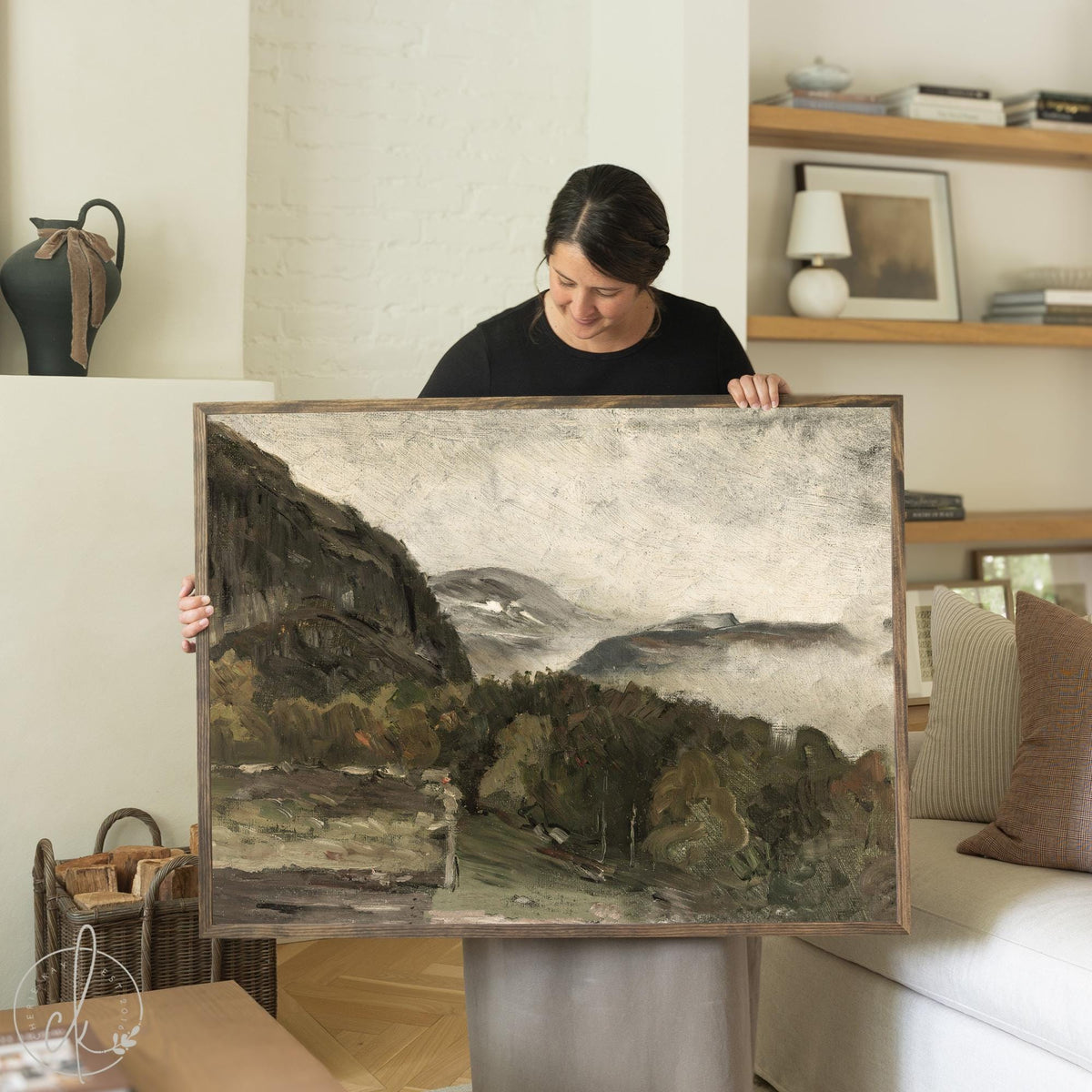 Framed mountain wall art featuring a moody landscape with wood frame and neutral tones for living room or bedroom decor.