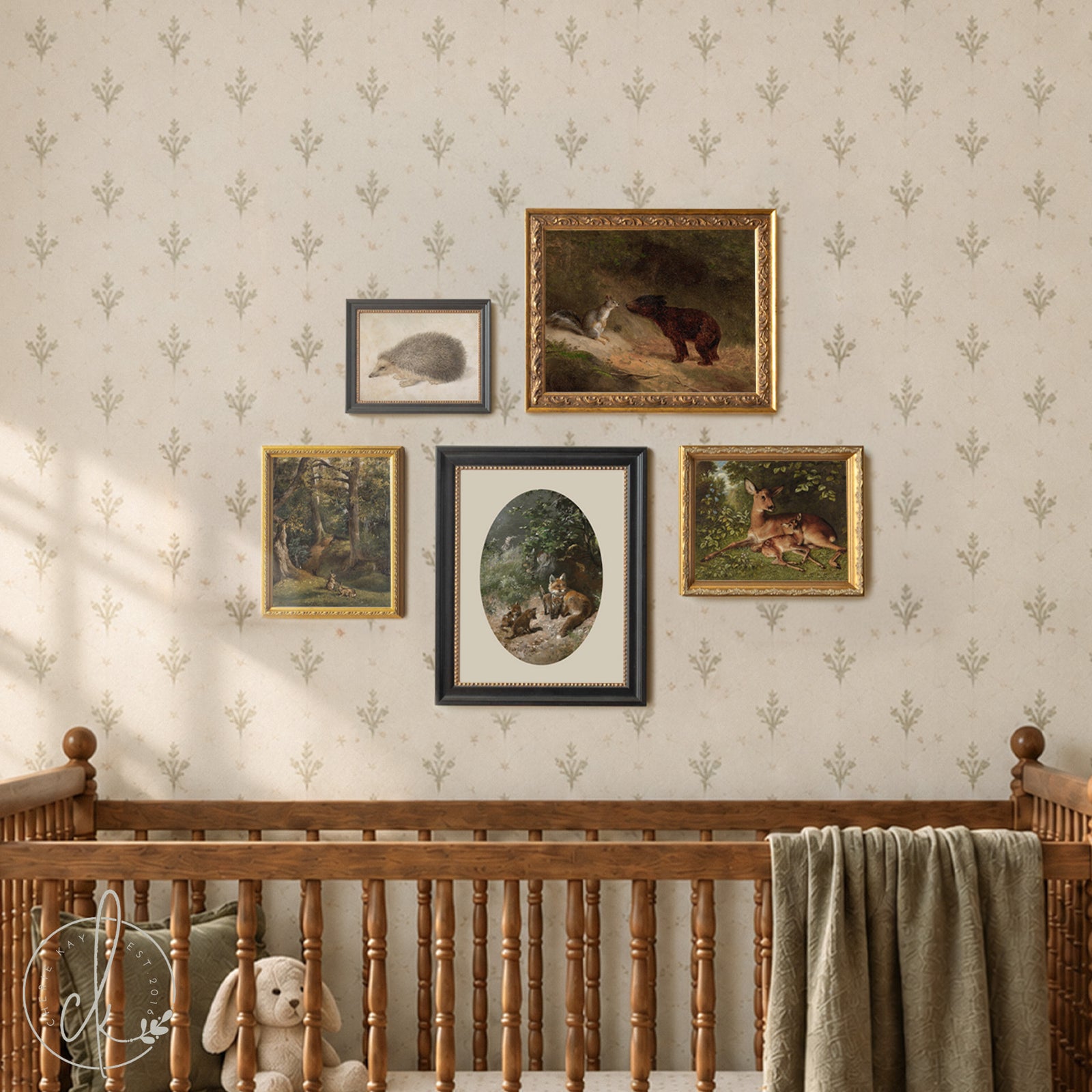 Woodland nursery wall art set of five vintage-style animal prints (fox, hedgehog, deer, squirrel, bear) in ornate gold and black frames.