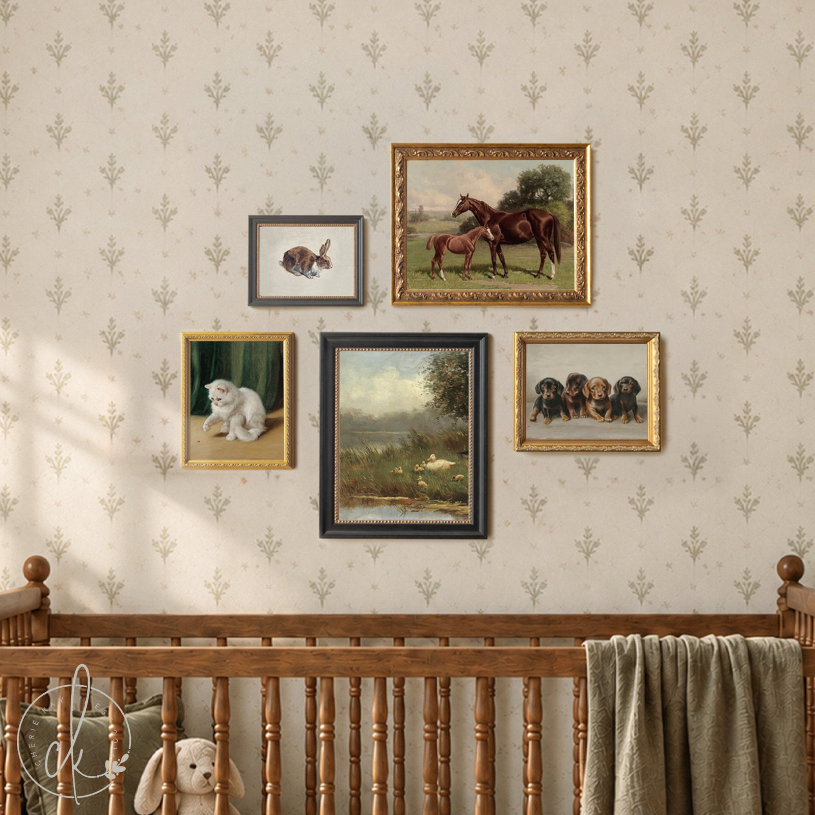 Framed nursery gallery wall with vintage animal prints above a baby crib in soft neutral tones.