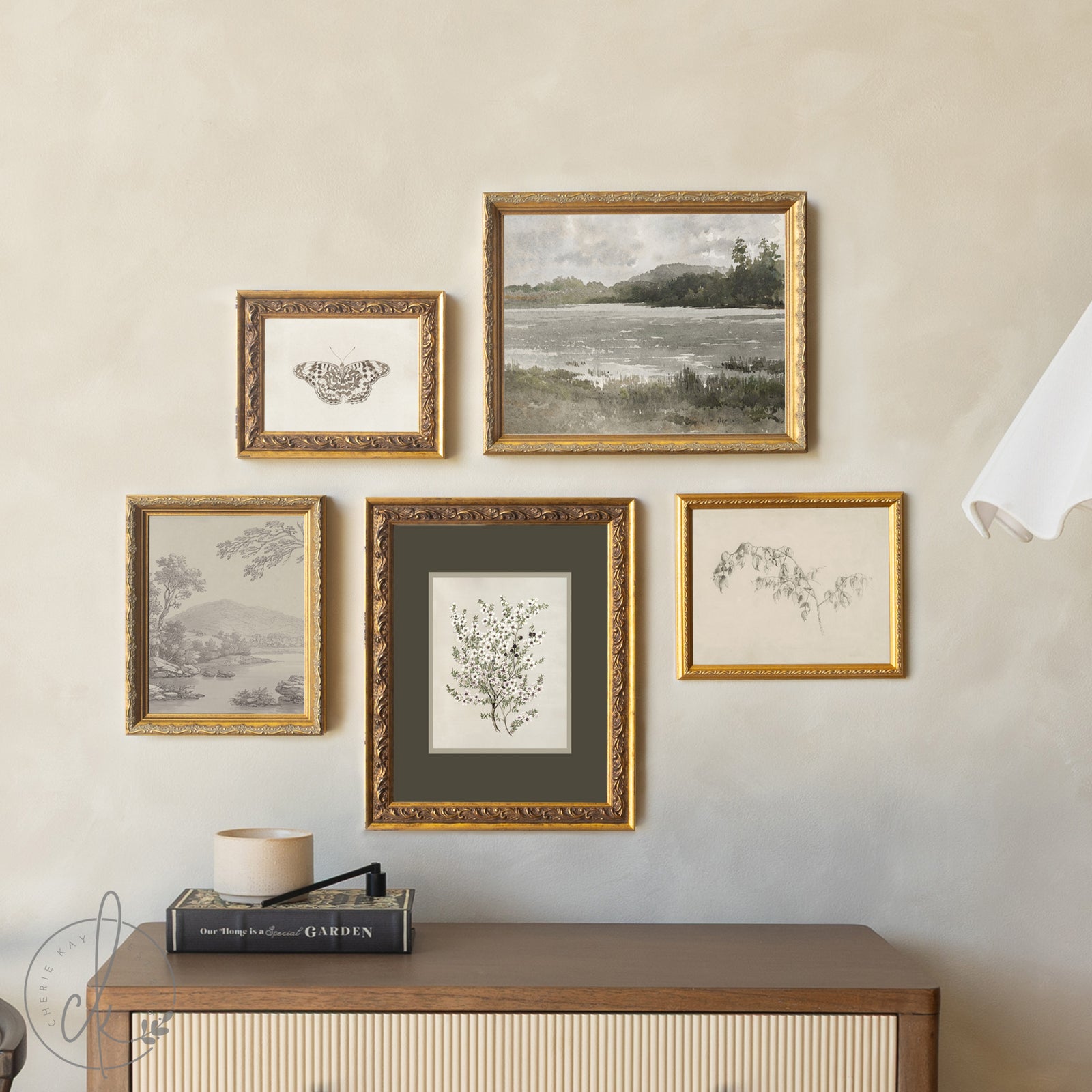 Alt Tag: vintage framed prints set of 5 botanical gallery wall art in gold frames with butterfly, landscape, and nature sketches