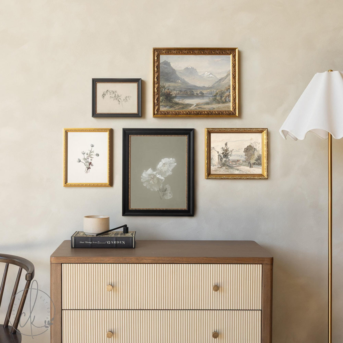 Framed living room wall art set with vintage landscape and botanical prints in gold and black frames.