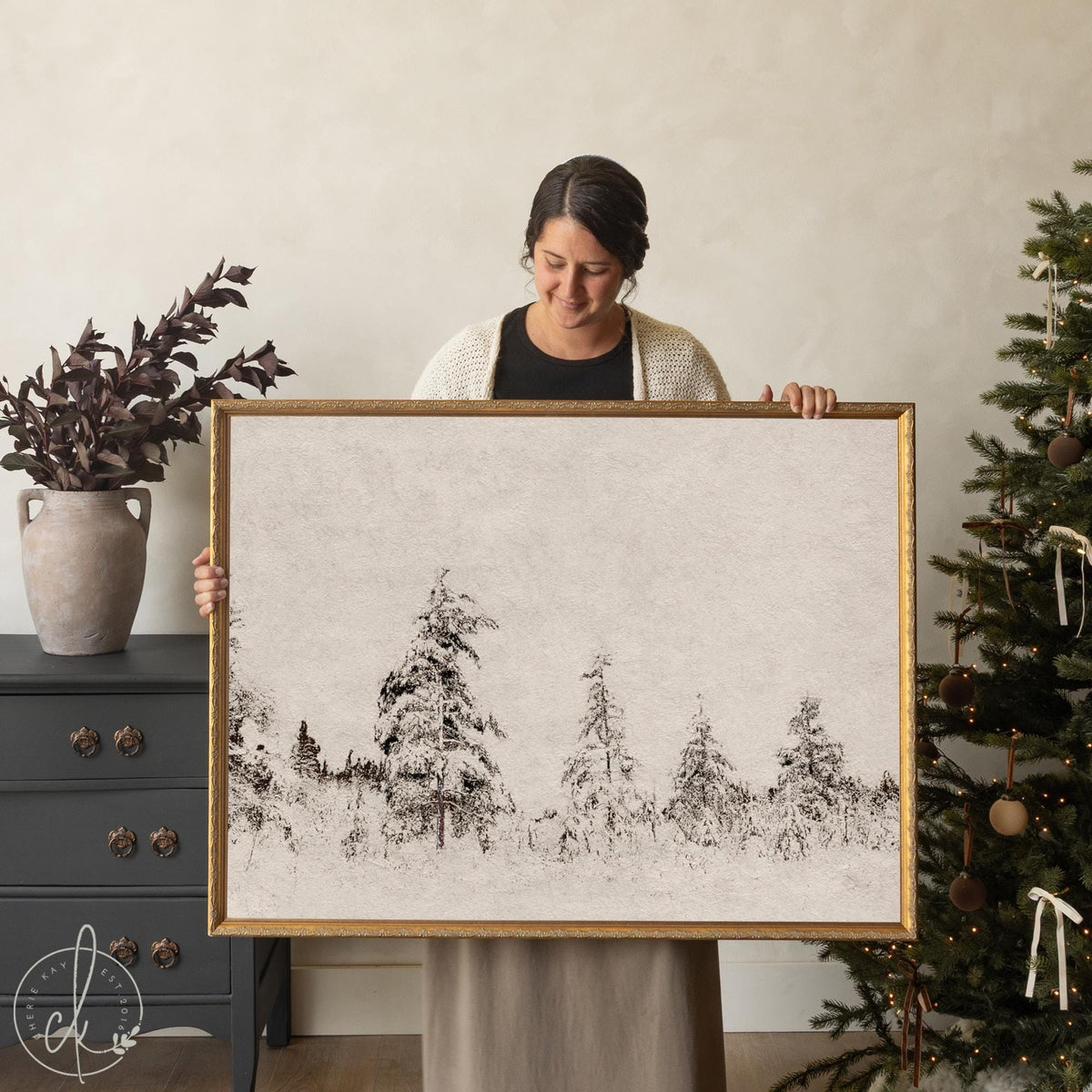 Framed winter wall art with snowy forest scene in gold frame, ideal for Christmas home decor.