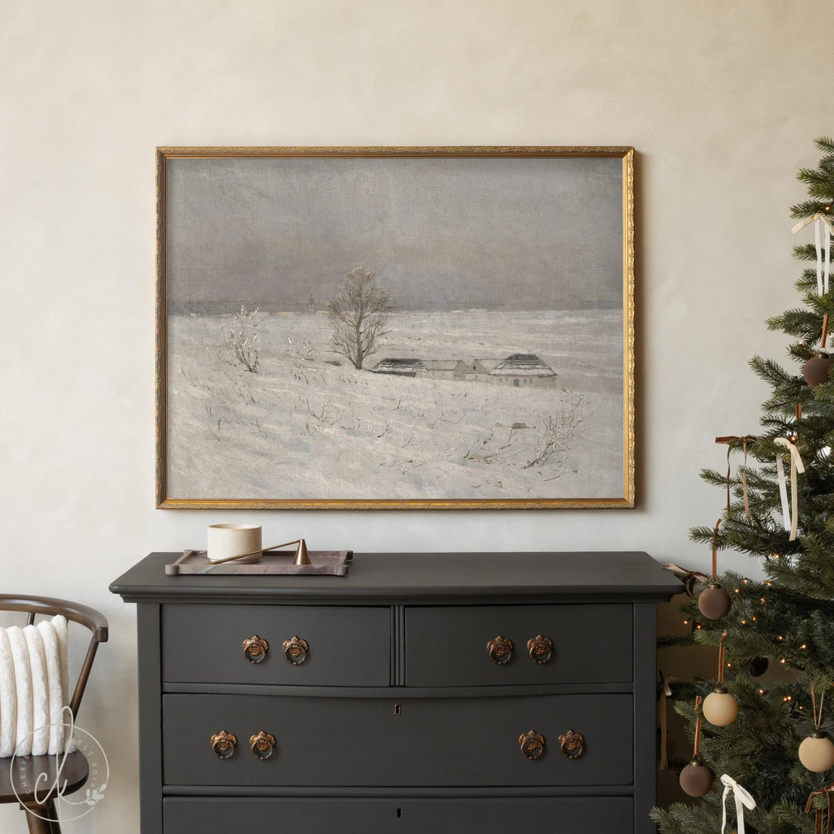Framed snowy landscape painting with farmhouse in winter field — neutral wall art for living room or Christmas decor.