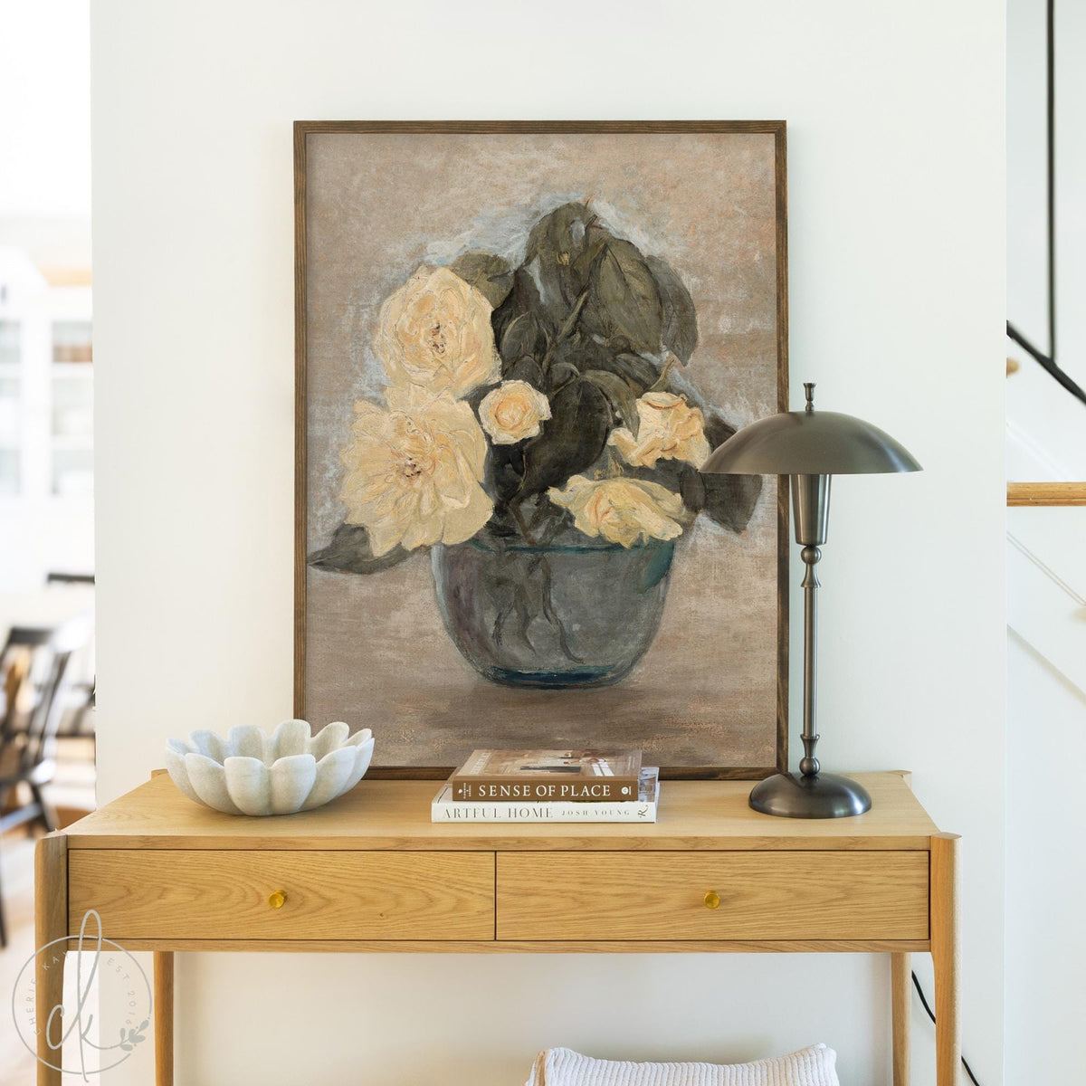 Framed canvas print of a flower vase painting in soft natural colors for living room or entryway.