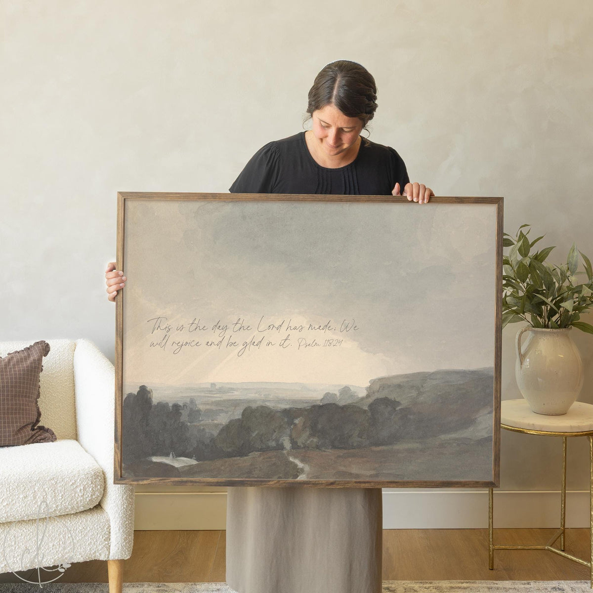 Framed landscape art with Psalm 118:24 verse over a soft countryside scene.