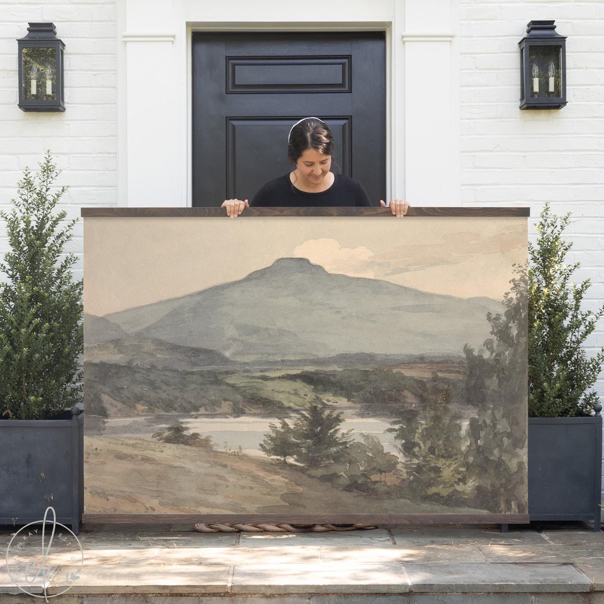 Large mountain landscape art on canvas tapestry with wooden frame hangers — neutral wall decor.