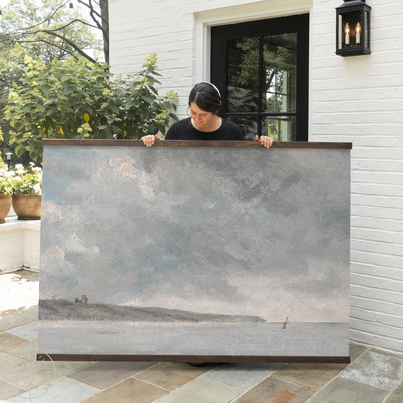 Large coastal art wall hanging with soft ocean sky and shoreline in blue-gray tones.