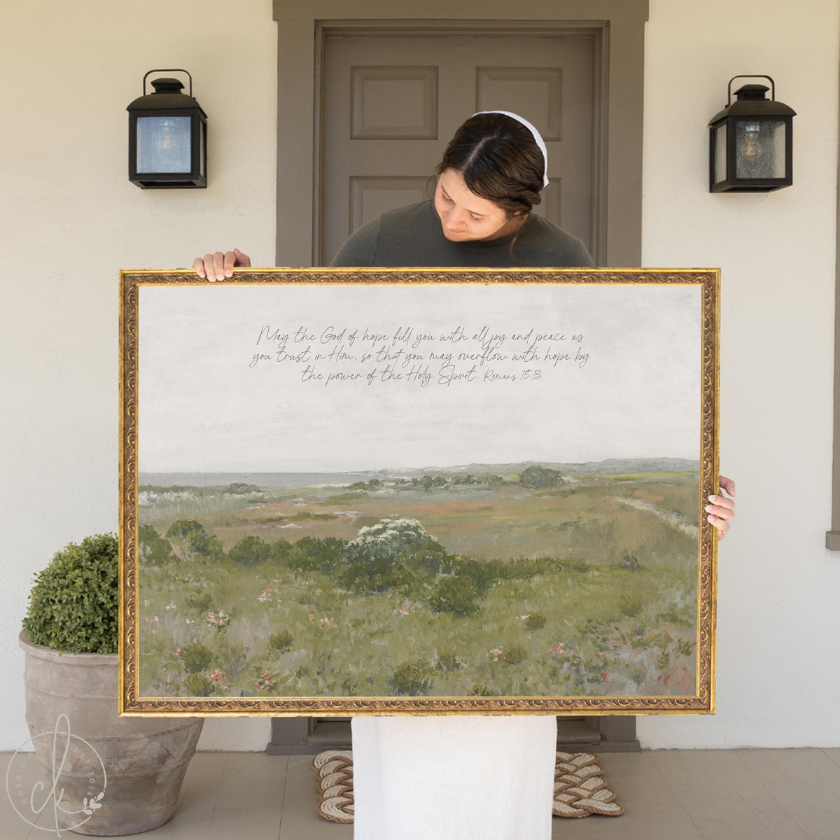 Large framed landscape with Romans 15:13 scripture — Bible verse wall decor in gold frame.