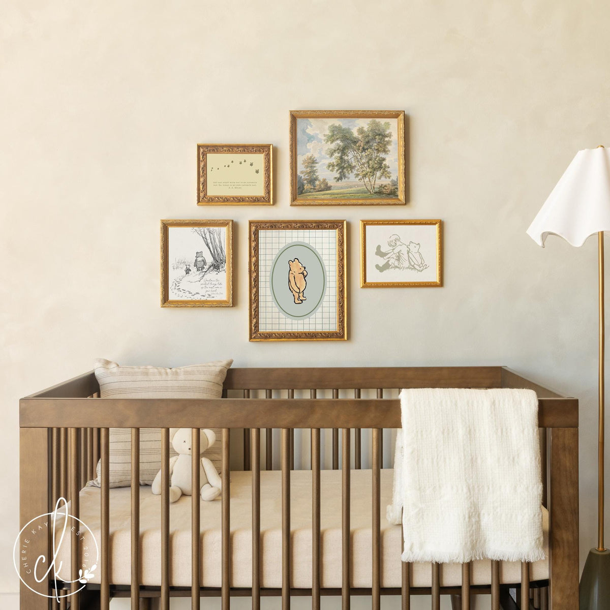 Winnie the Pooh wall decor vintage nursery gallery wall with framed canvas prints above crib.