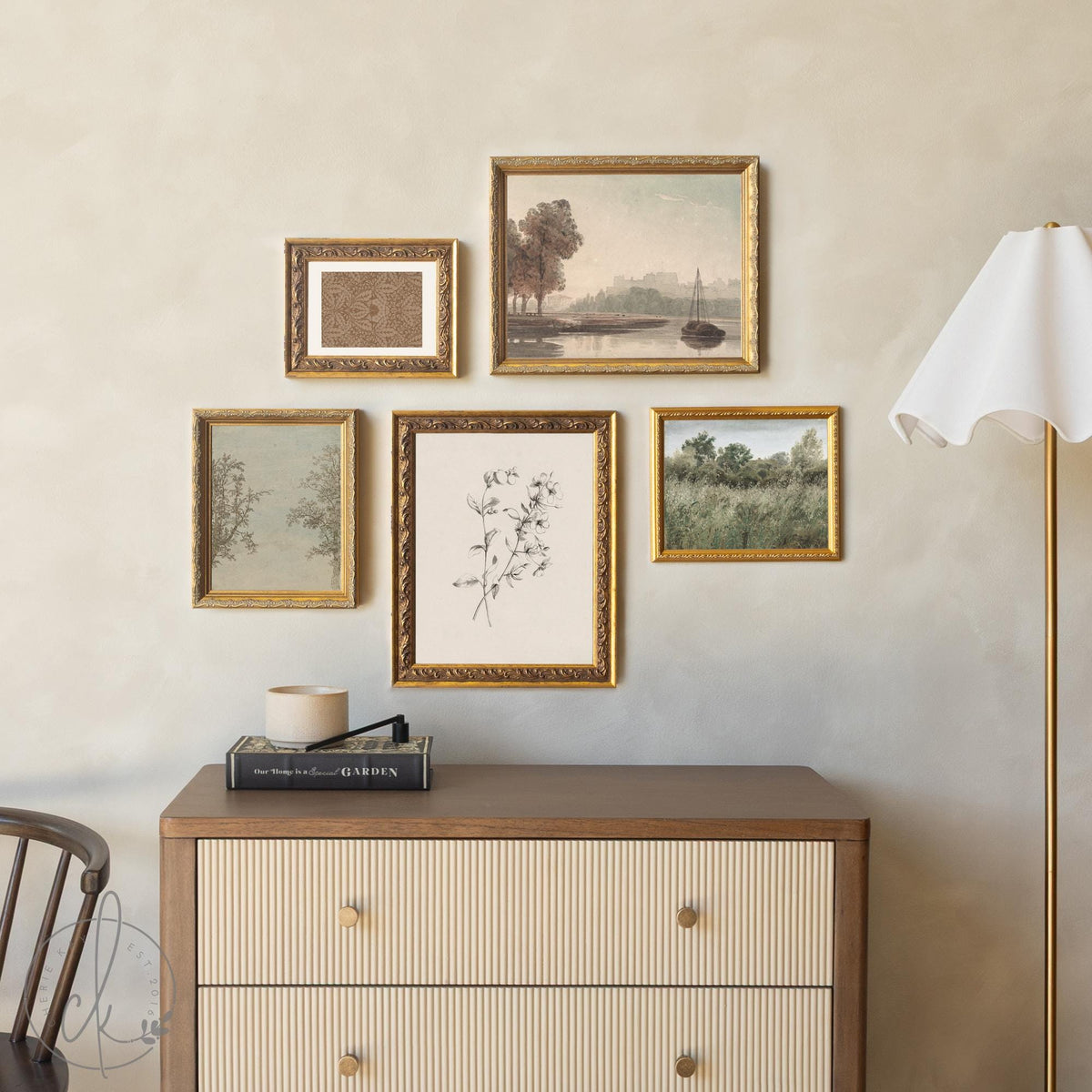 Framed wall art set with vintage landscapes and botanical prints in gold frames for living room decor.