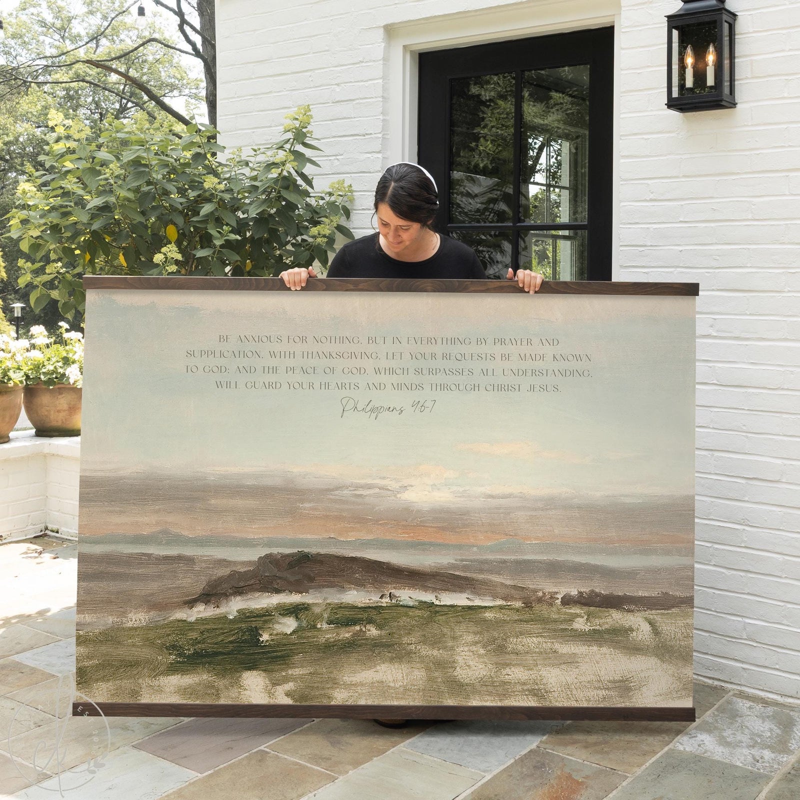 Bible verse canvas featuring Philippians 4:6-7 printed on a soft landscape painting.