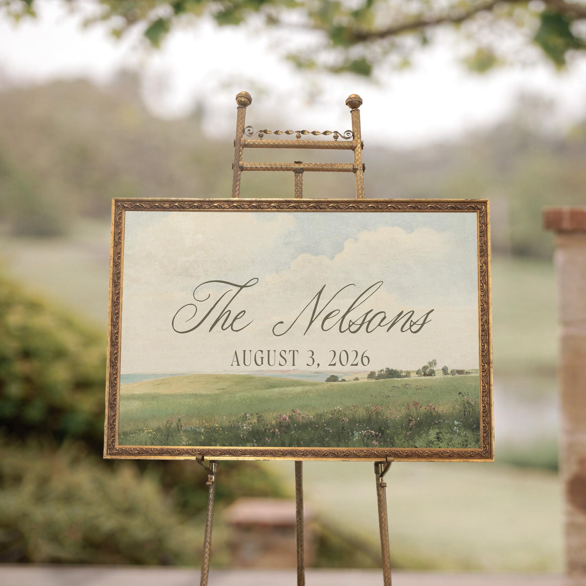 Wedding welcome sign with vintage green meadow landscape and personalized last name in gold frame