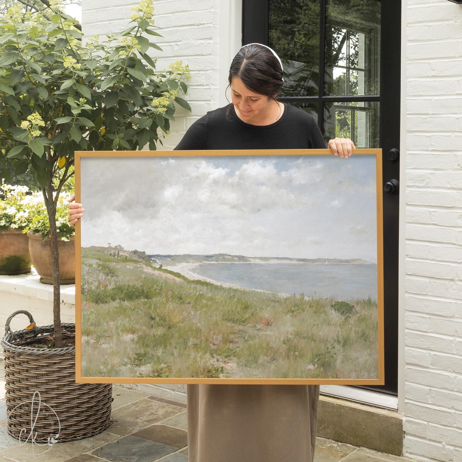 Framed coastal art canvas print in gold wood frame showing an American Impressionist beach landscape with dunes and bay
