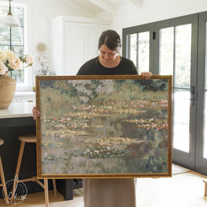 Monet water lilies print in ornate gold frame with pink lilies on green pond