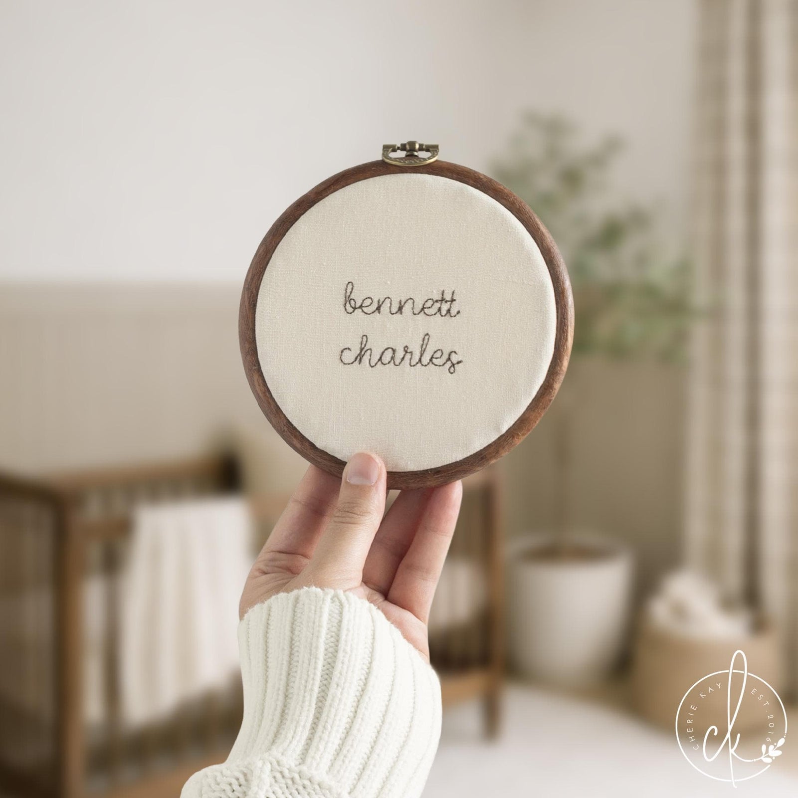 Personalized nursery decor embroidered name hoop sign on cream linen in dark walnut frame with brass hardware