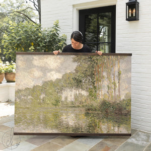 Poplars on the Epte canvas banner showing tall poplar trees over a river, finished in a natural wood frame.