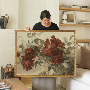Burgundy wall art featuring large roses in deep red and sage green in an ornate antique gold framed canvas