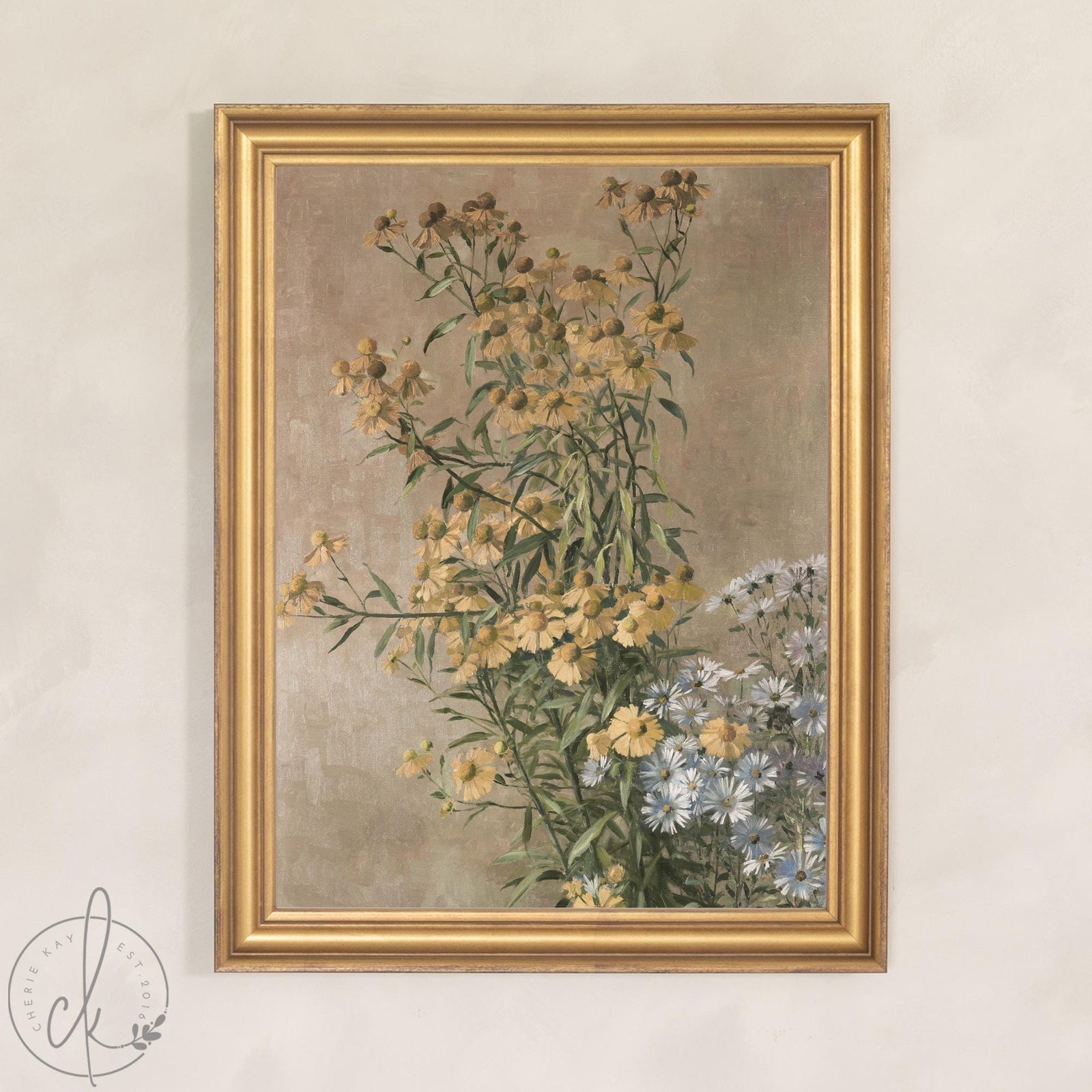 Vintage botanical print of golden yellow daisies and white asters in a chunky gold wood frame on a soft beige wall.