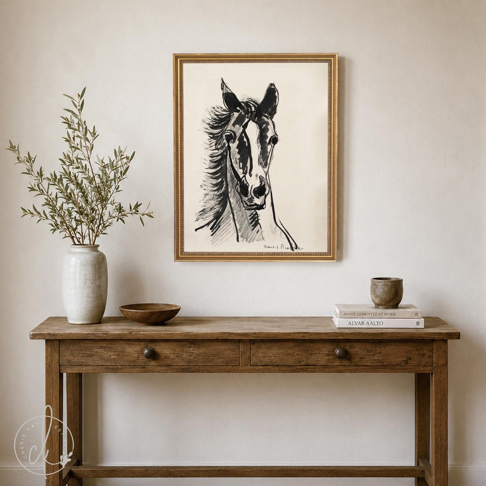 Black and white horse art with a single ink-style horse head on cream in a gold frame