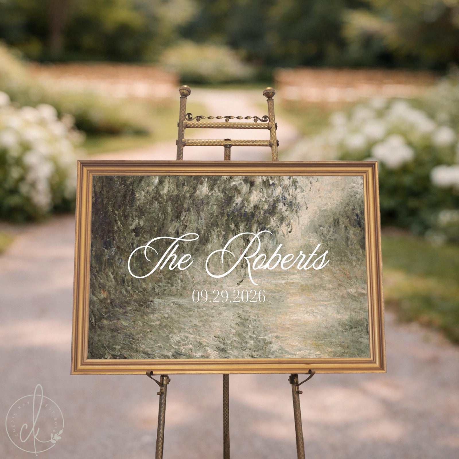 Personalized welcome sign on canvas in a gold frame, green impressionist landscape with names and wedding date in script.