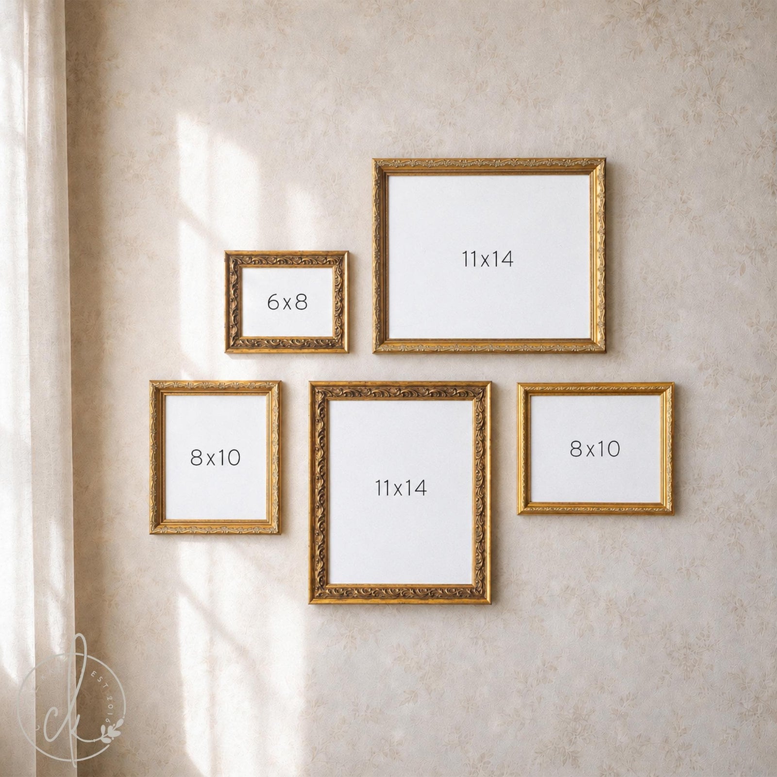 Antique gold picture frame set of five empty ornate frames in 6x8, 8x10, and 11x14 sizes hung on a soft floral wall