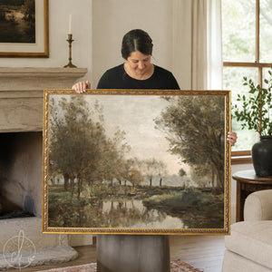Framed canvas fall landscape painting of willow trees and a rowboat on a misty pond, in an ornate gold frame.