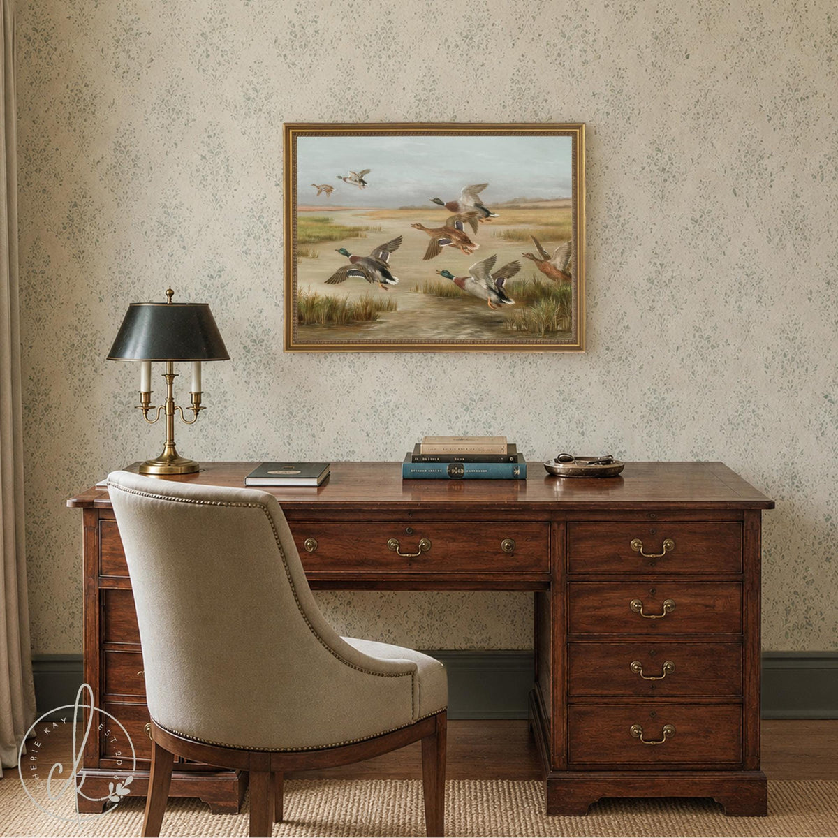 Mallard duck painting of ducks taking flight over a marsh, framed canvas in an ornate gold frame hung above a desk