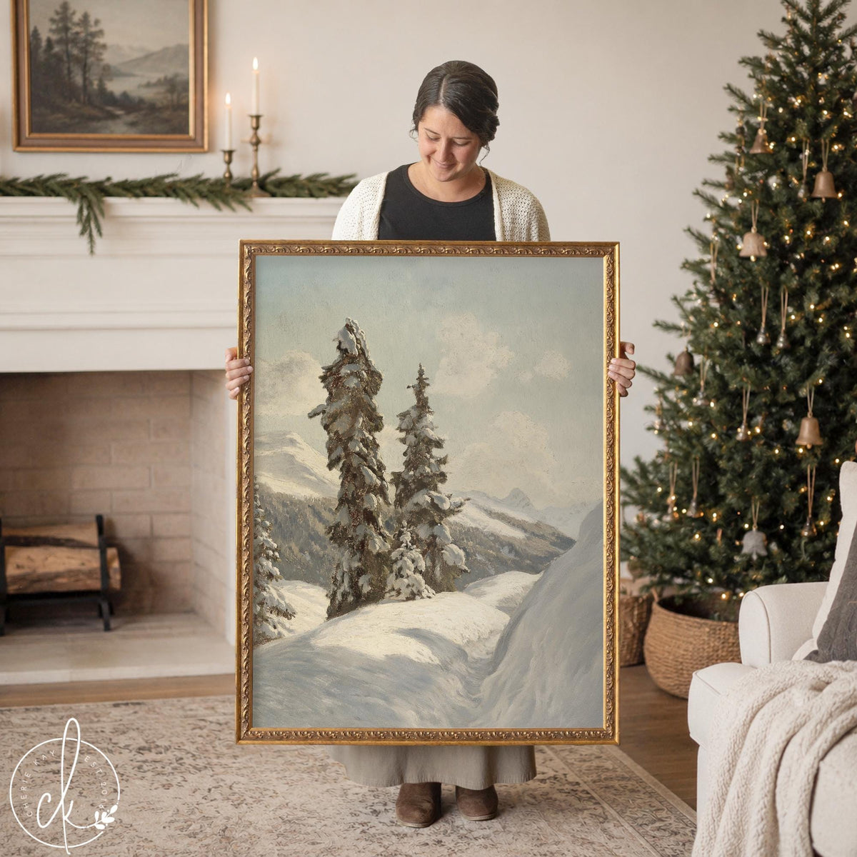 Vintage Christmas print of snowy alpine evergreens on a mountain slope in an ornate gold frame, held up in a living room
