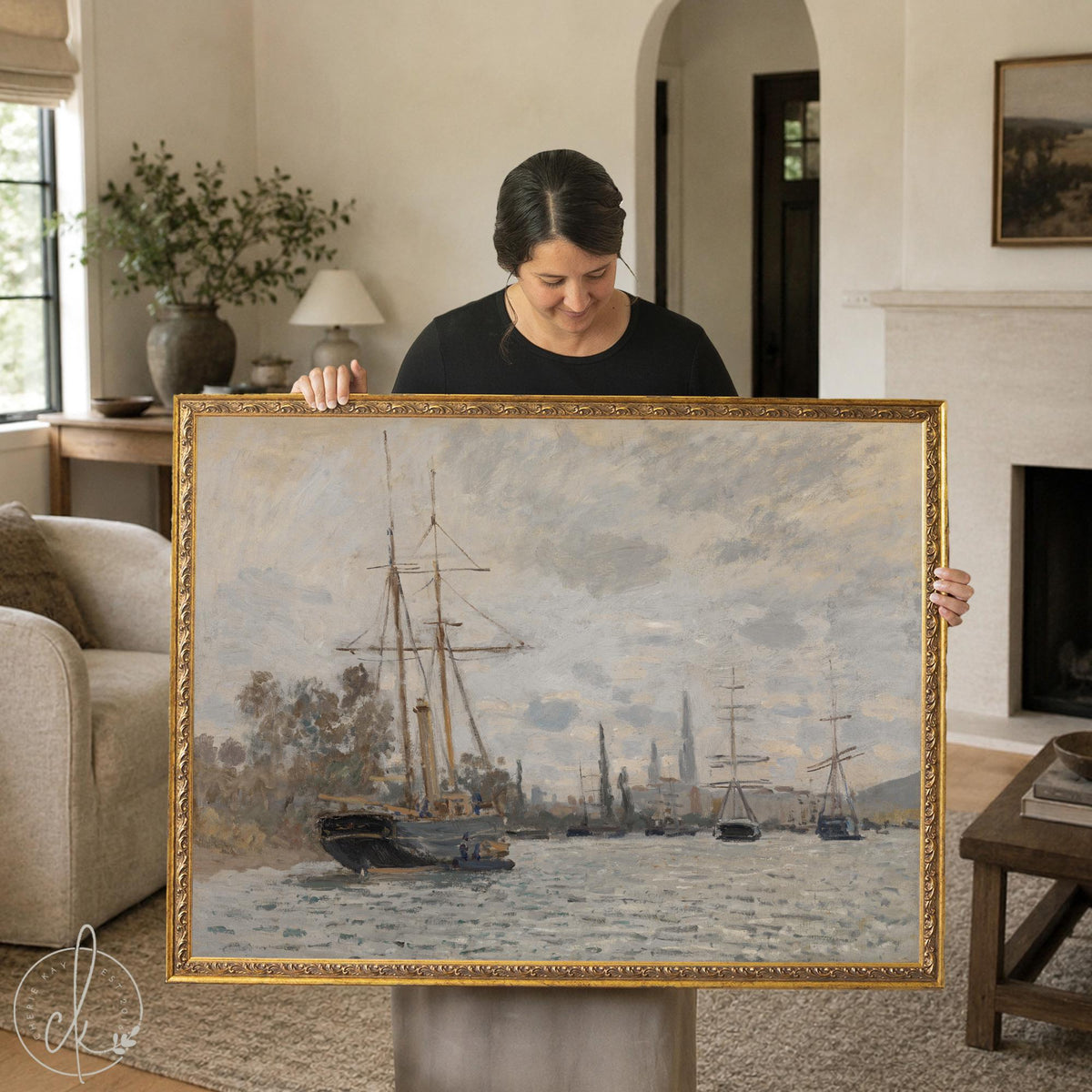 Sailboat painting, Monet’s The Seine at Rouen in an ornate gold frame, tall ships on a gray river, held up in a living room