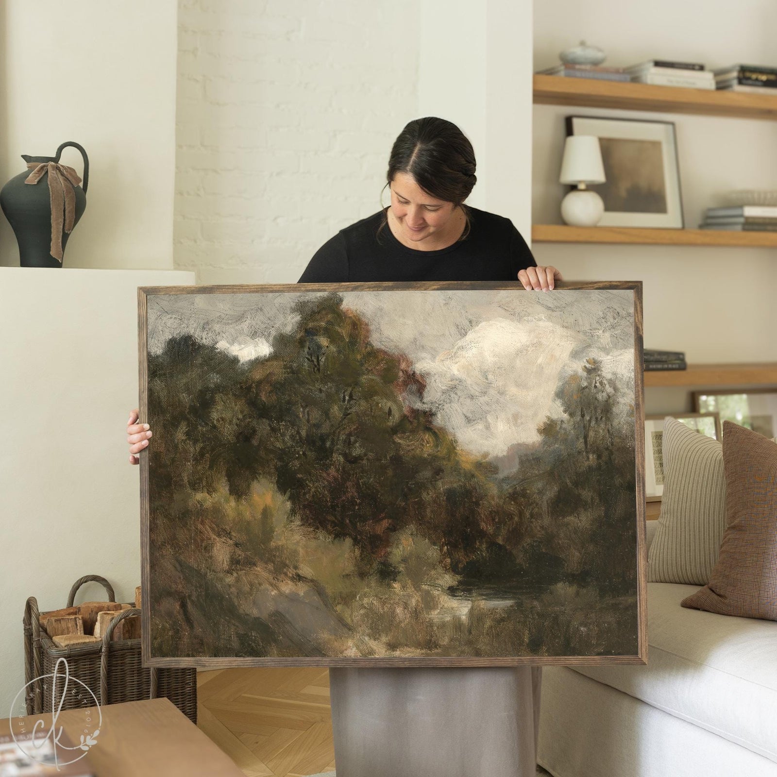 Framed moody landscape painting in earth tones with natural wood frame, perfect as neutral wall art for living room or bedroom.