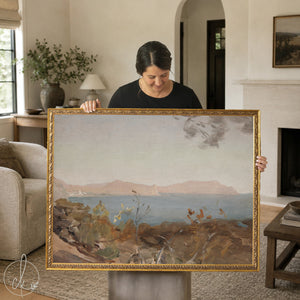 Vintage coastal wall art featuring Mediterranean seascape with rocky shoreline and distant mountains in ornate gold frame