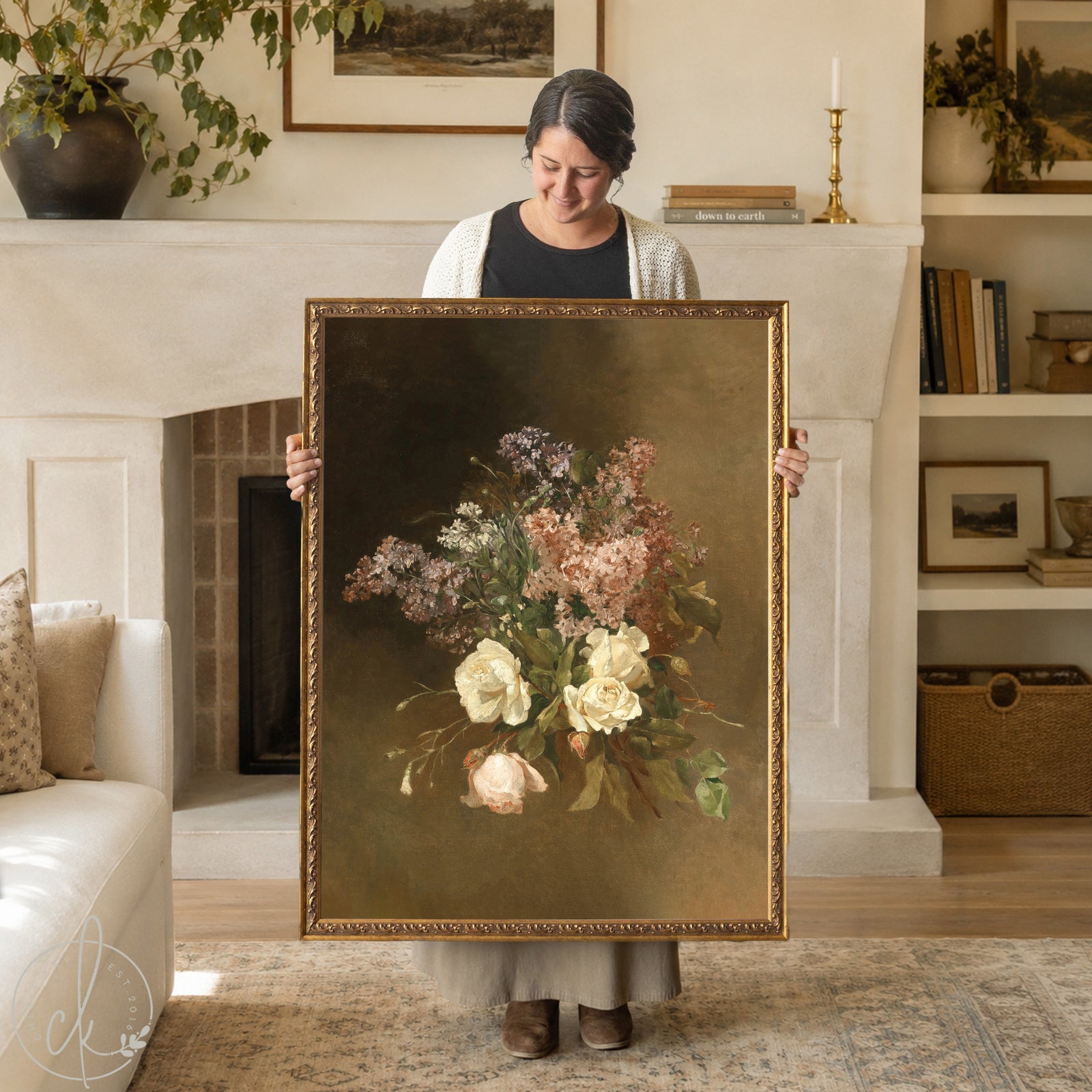 woman holding Bouquet painting of cream roses and lilacs in a gold frame