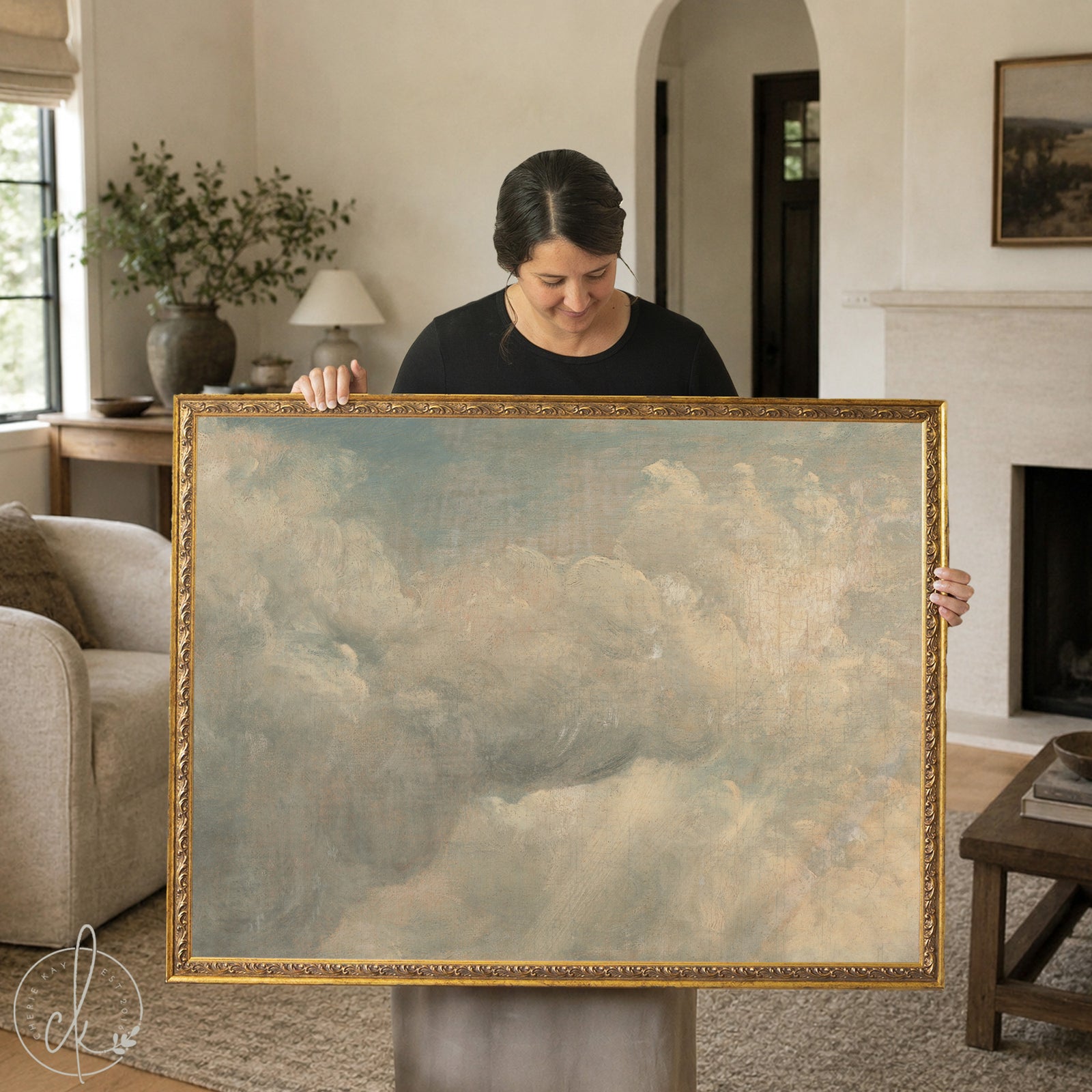 Vintage cloud painting with soft sunlit clouds on a muted blue sky in a gold frame