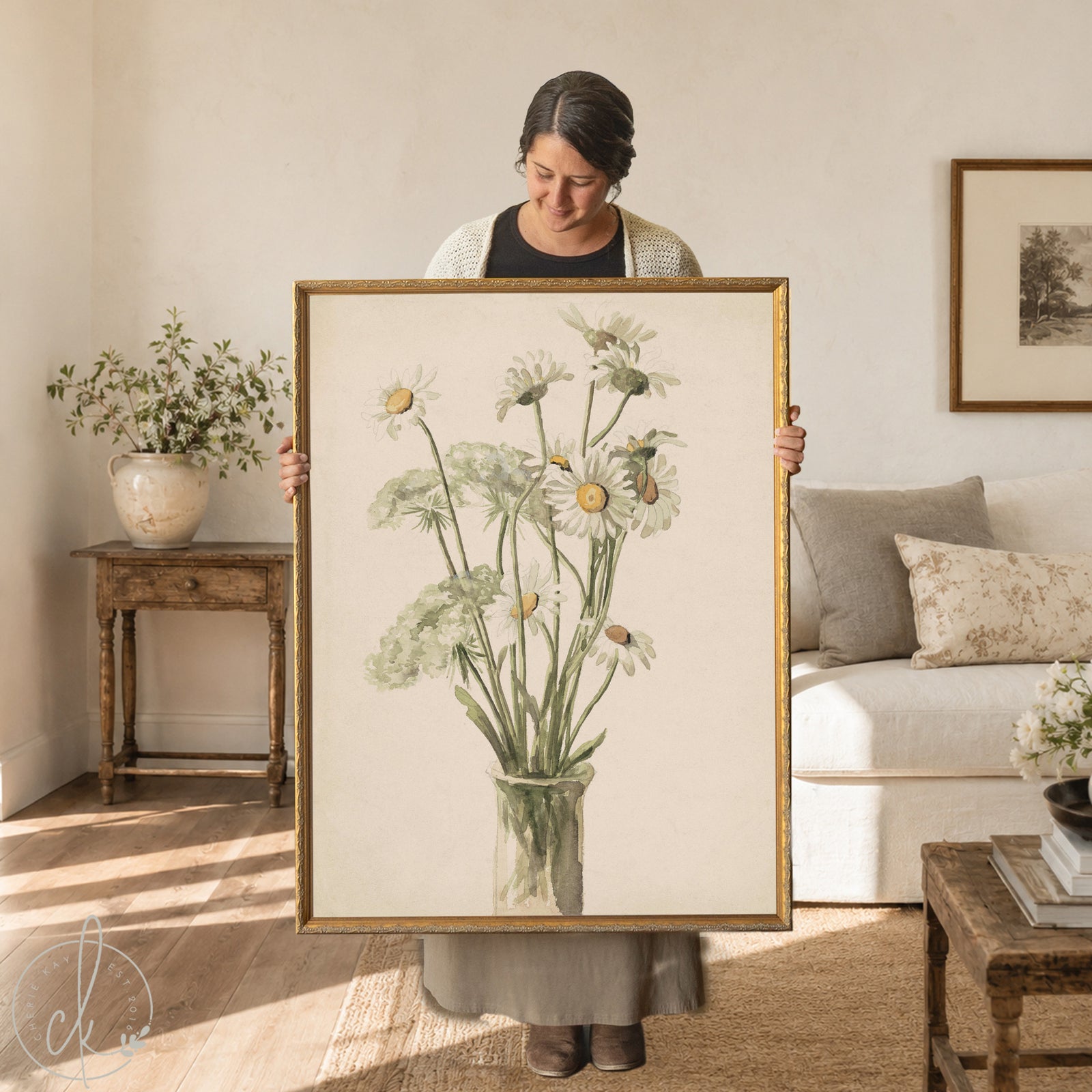 Daisy wall decor with white daisies and Queen Anne's lace in a glass vase in an ornate gold wood frame