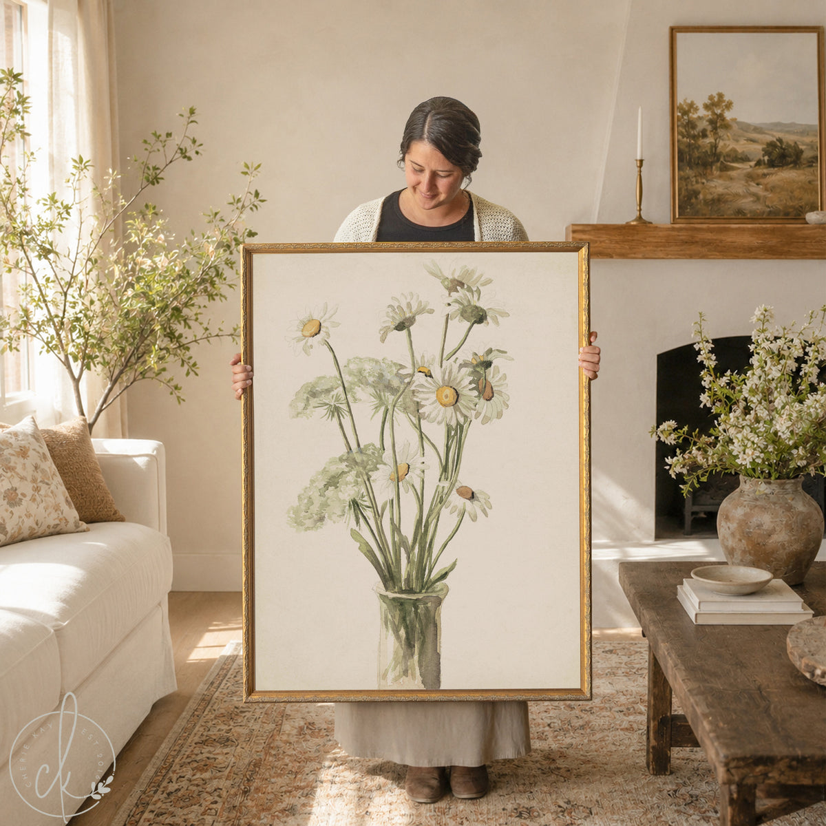 Daisy wall decor with white daisies and Queen Anne's lace in a glass vase in an ornate gold wood frame