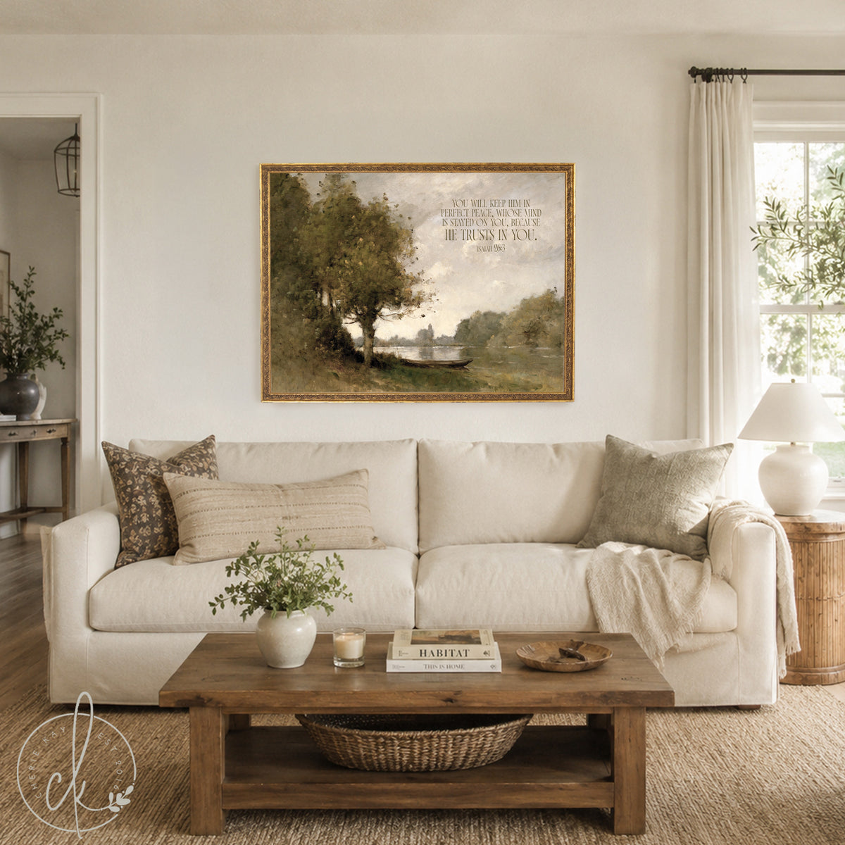 A rectangular landscape painting in a gold frame featuring a river scene with trees and a small boat. The text reads: You will keep him in perfect peace, whose mind is stayed on you, because he trusts in you. Isaiah 26:3.