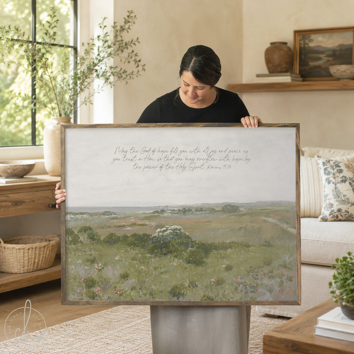 Scripture wall decor with Romans 15:13 verse on framed meadow landscape canvas.